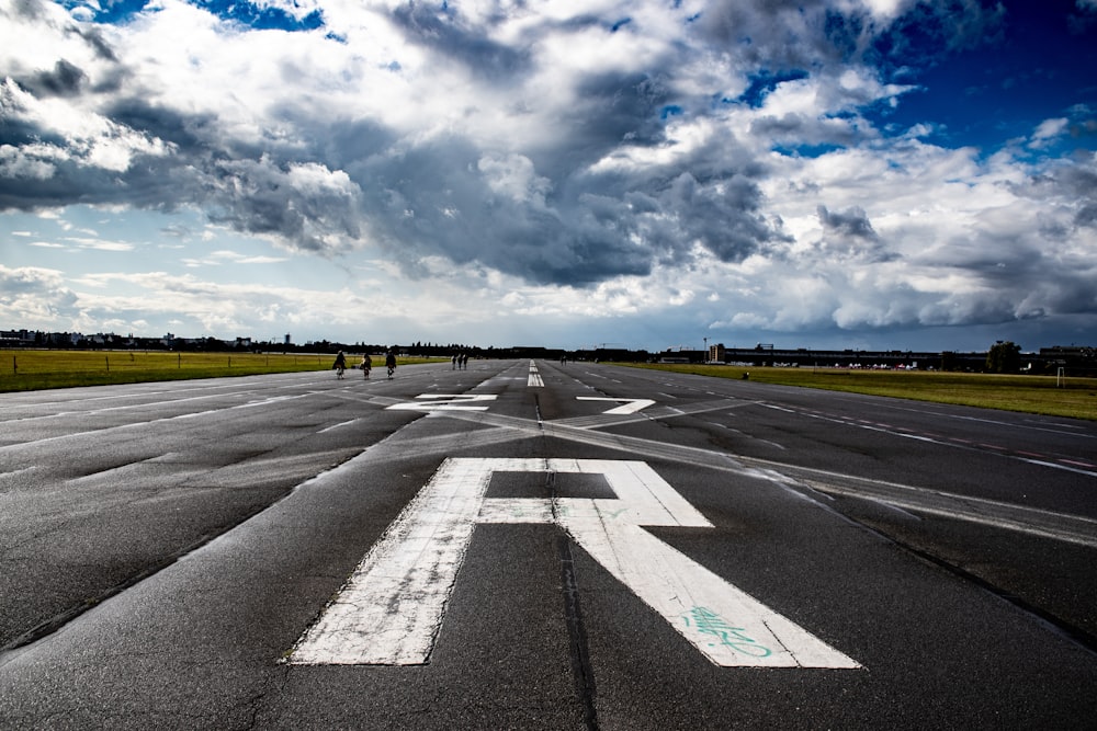 people walking on wide road during daytime