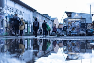 A group enjoying a guided tour through colorful graffiti-lined alleys in São Paulo.