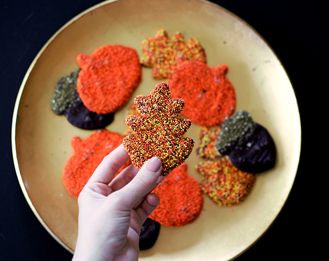 person picking Christmas tree themed cookie