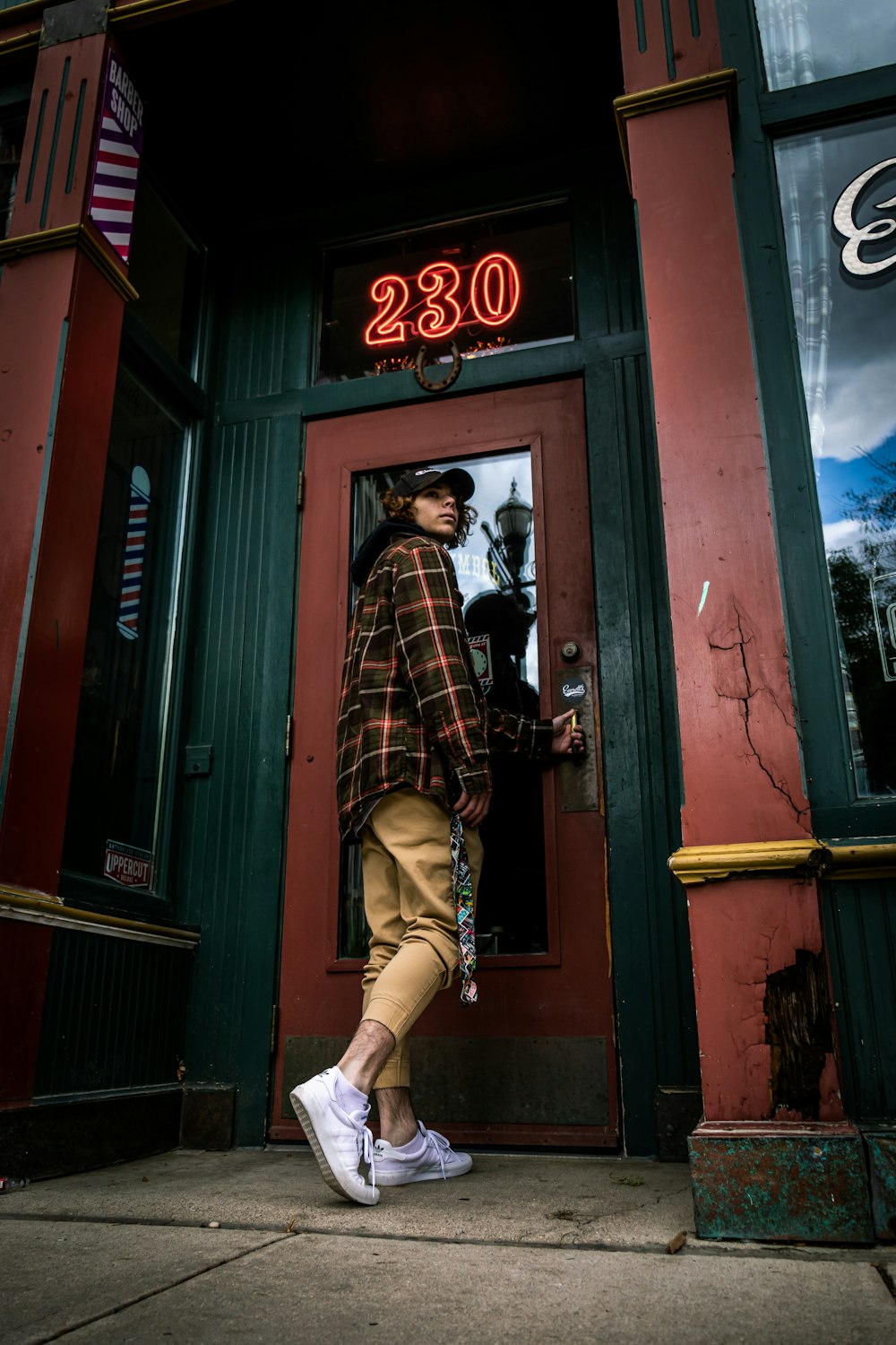 man standing beside door