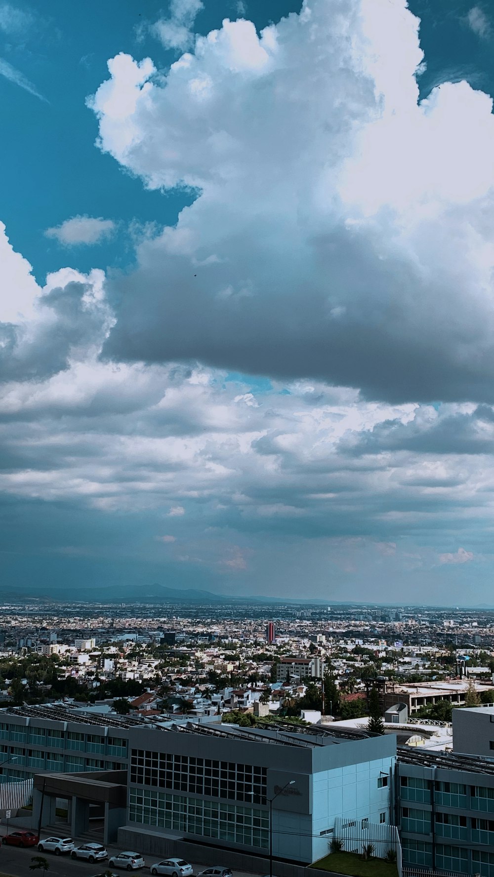 photography of city escape under blue cloudy sky