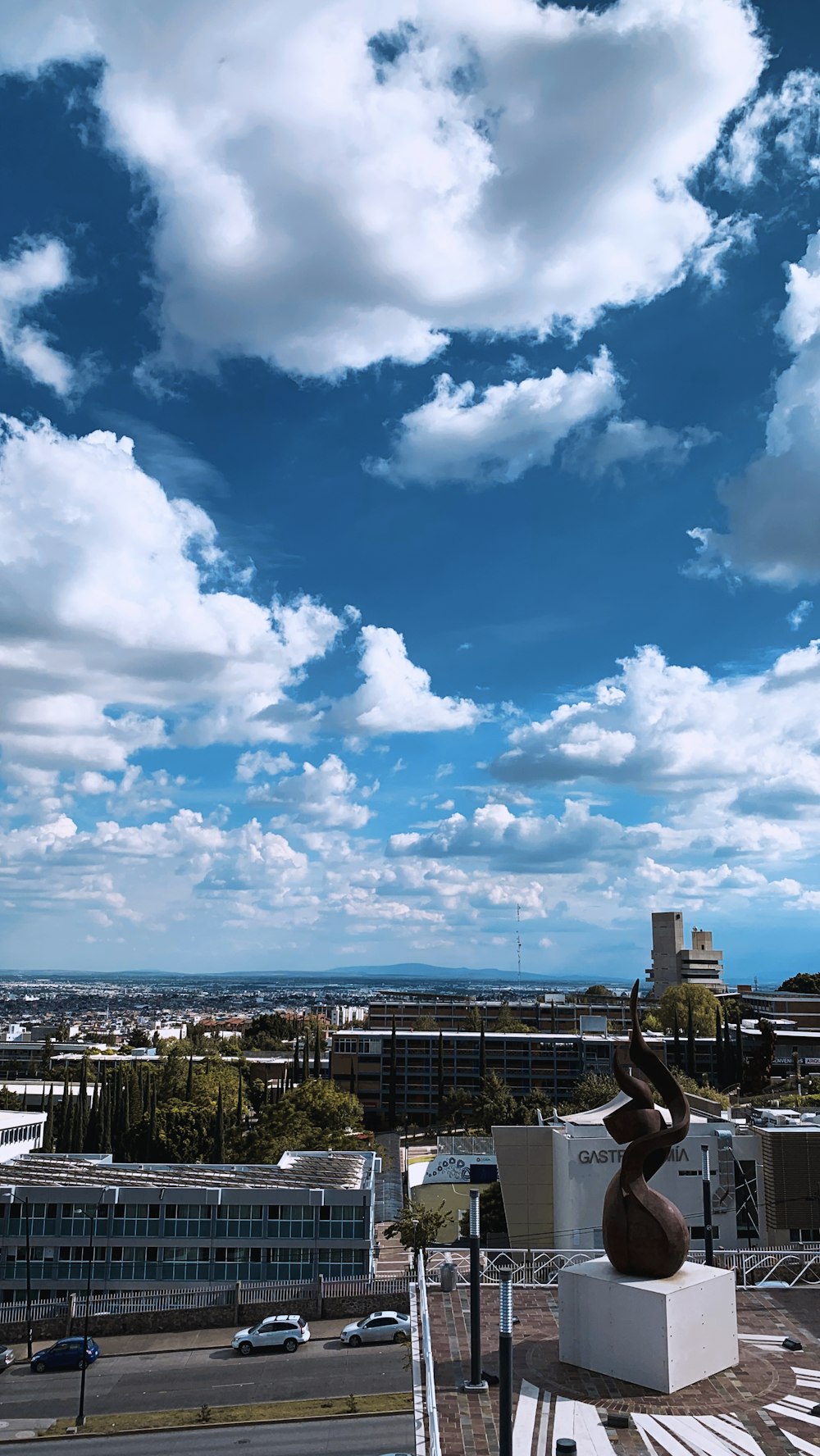 cityscape under blue and white sky