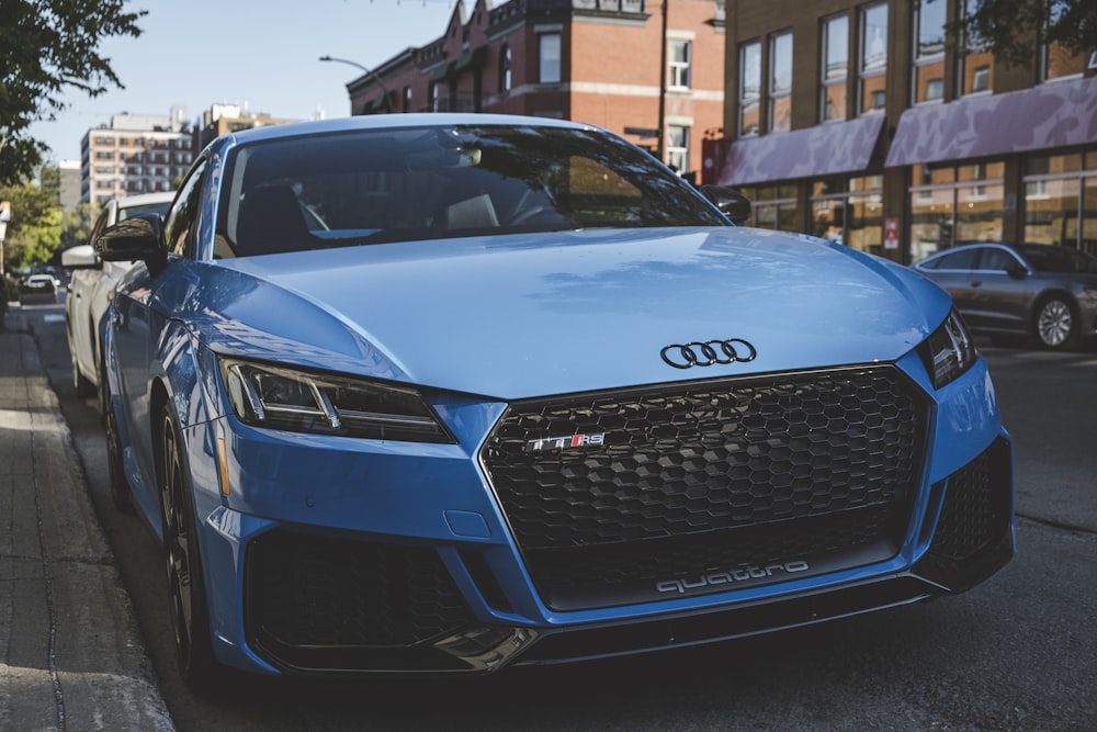 blue Audi TT coupe parking near road