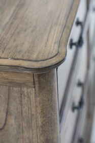 edge of brown wooden drawer