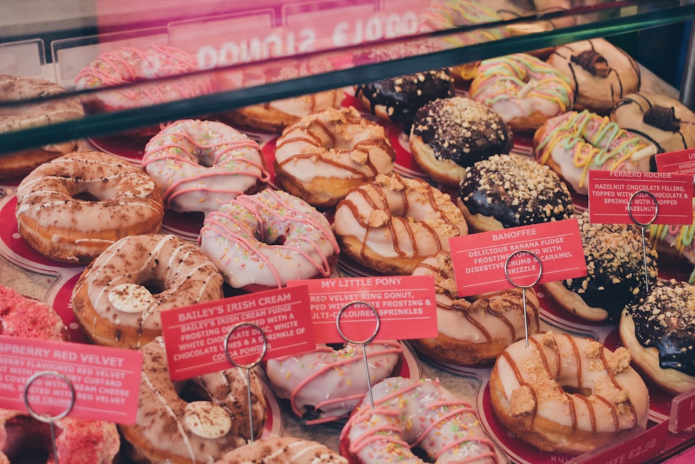 assorted flavor of donuts on display