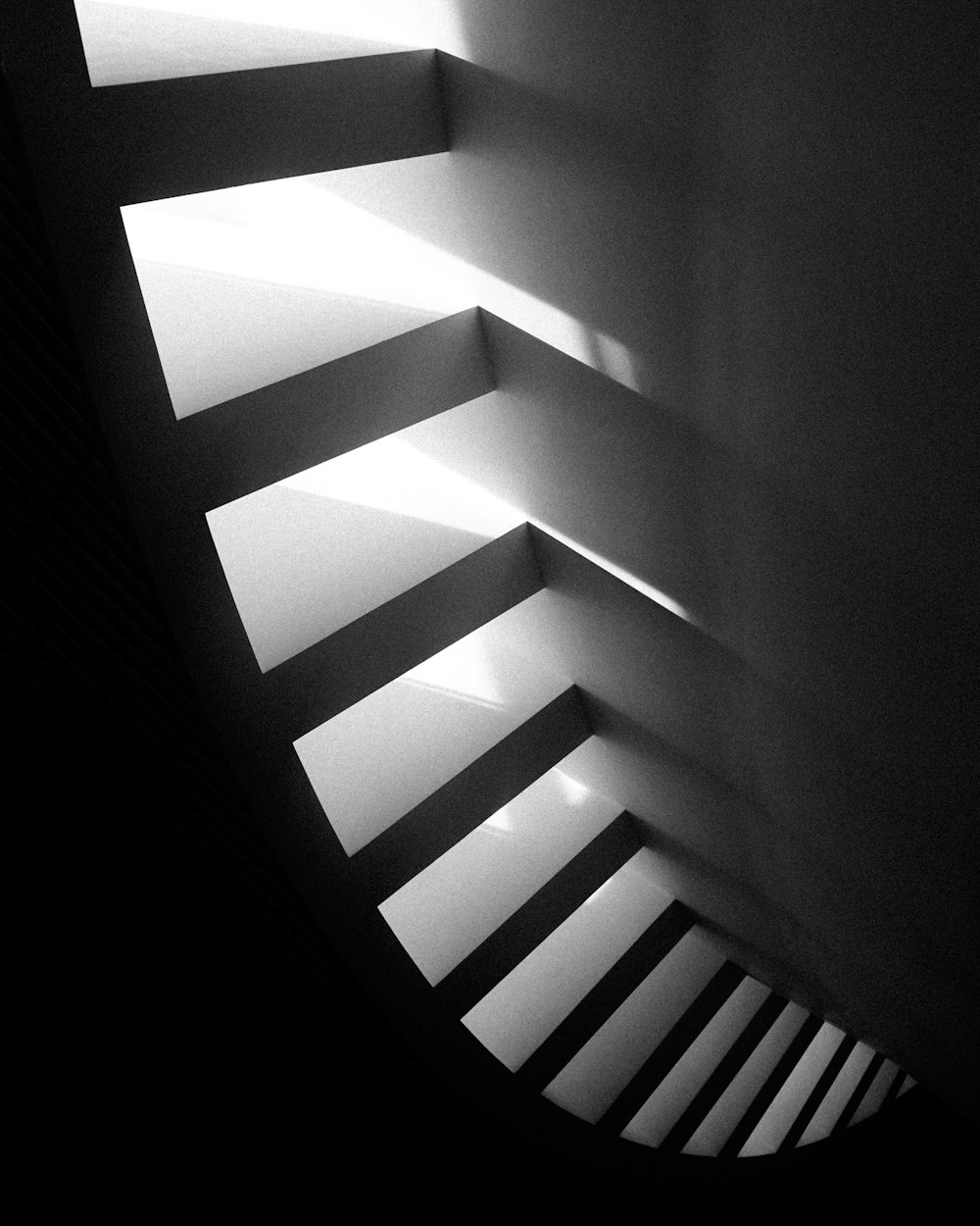 a black and white photo of a staircase