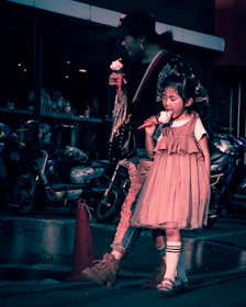 A mother and daughter sharing ice cream on a charming city street.