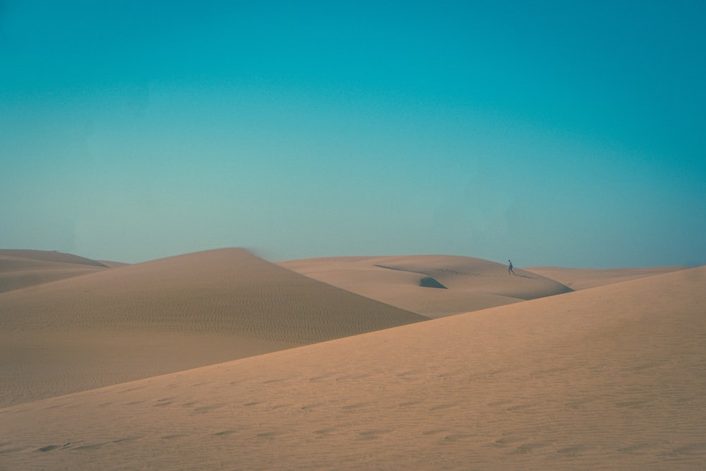brown sand mountain during daytime