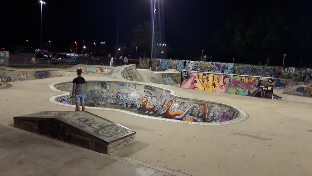 person in skateboard park during nighttime