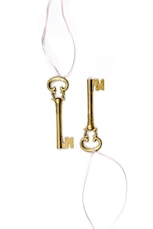 two gold-colored skeleton keys