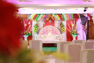 Intricately decorated wedding stage with traditional Indian motifs.