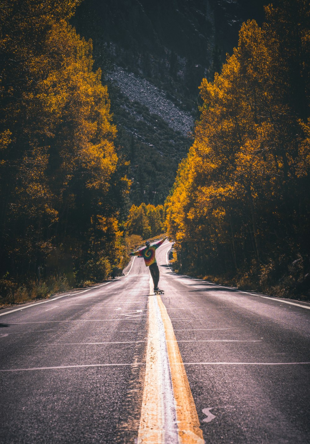 person standing on concrete road during daytime