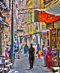 A vibrant street in Aligarh bustling with shops and people.