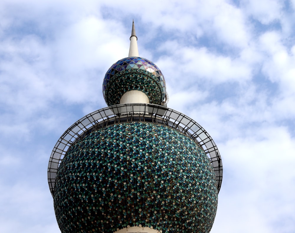 green round-top building under white sky