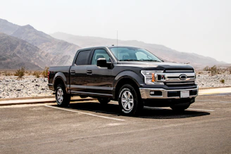 parked black crew-can pickup truck