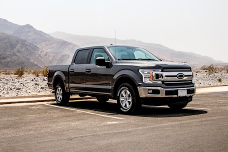 parked black crew-can pickup truck