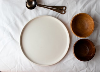 white tray and two brown bowls
