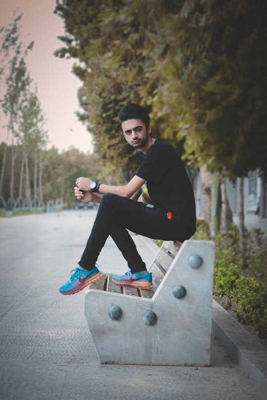man sitting on bench in Esfahan Iran