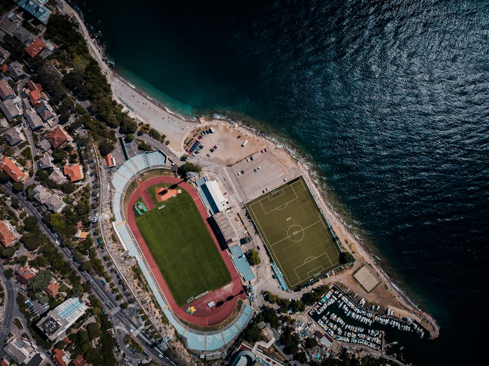 top view photography of buildings and body of water