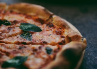 selective focus photography of two pizzas