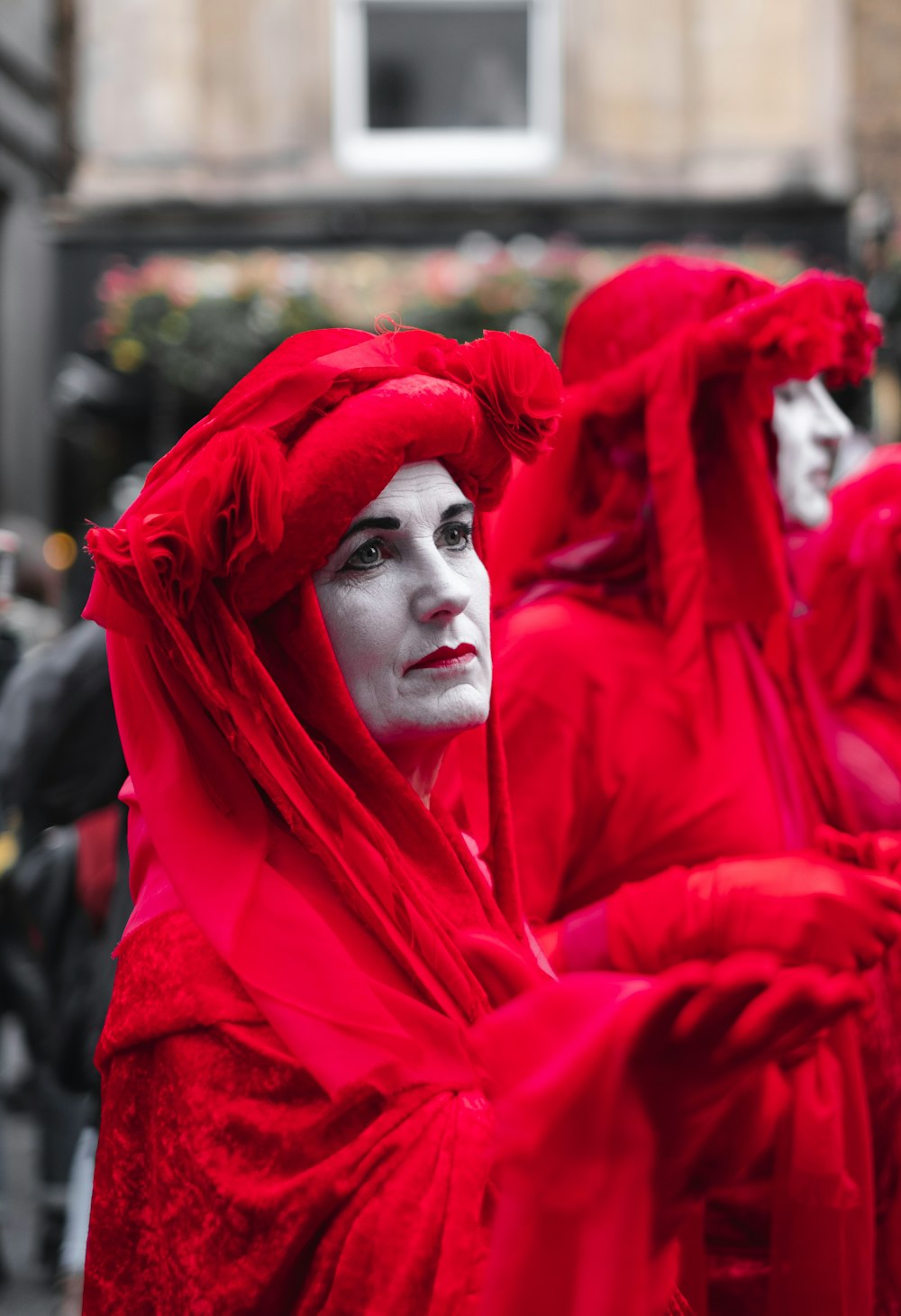 women in red headdresses