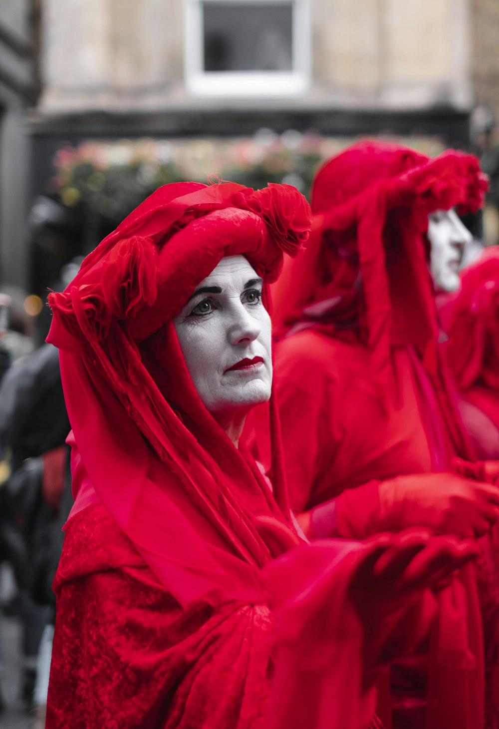 women in red headdresses