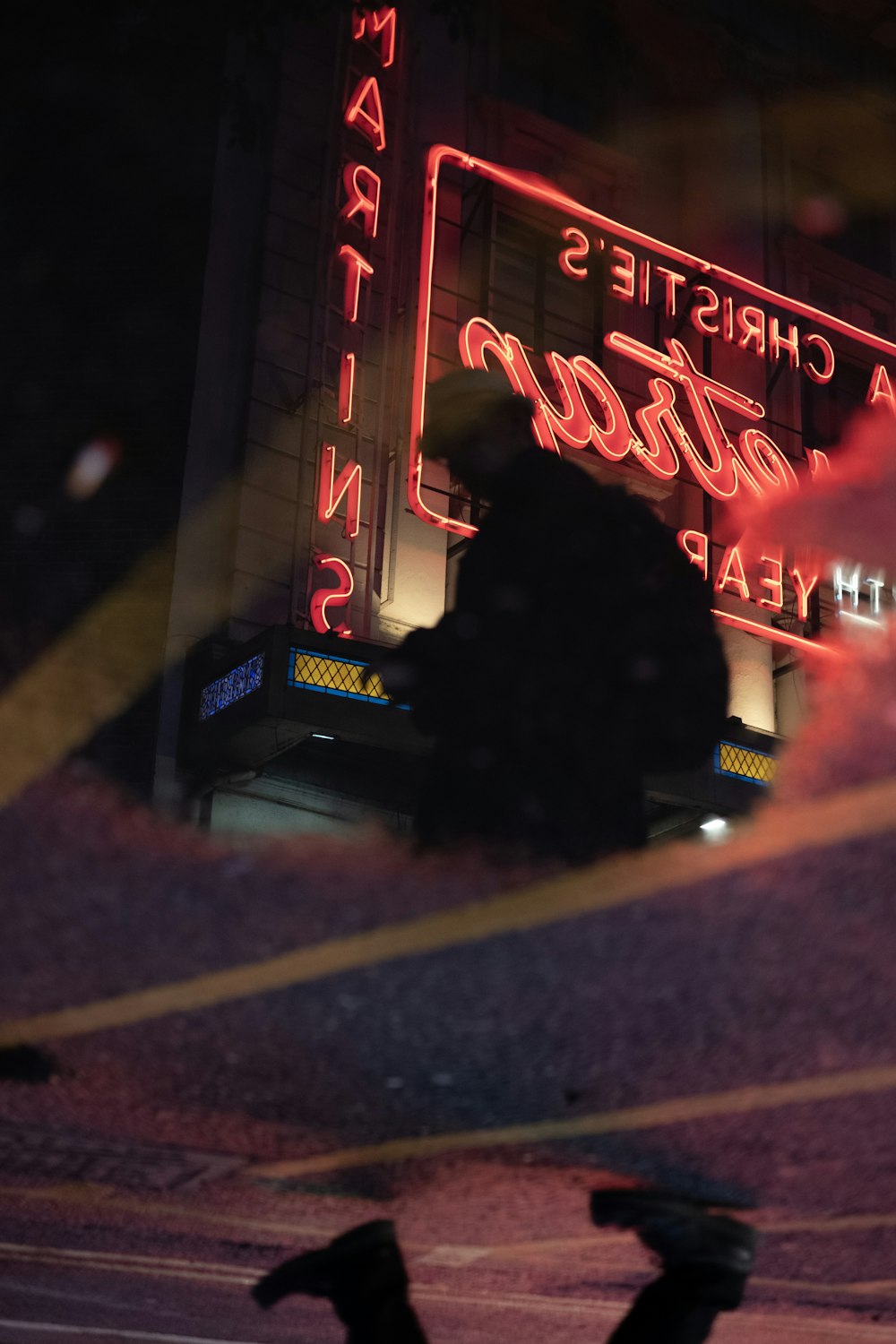 man near LED signage