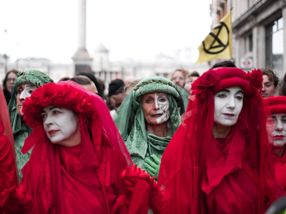 people wearing red and green veils