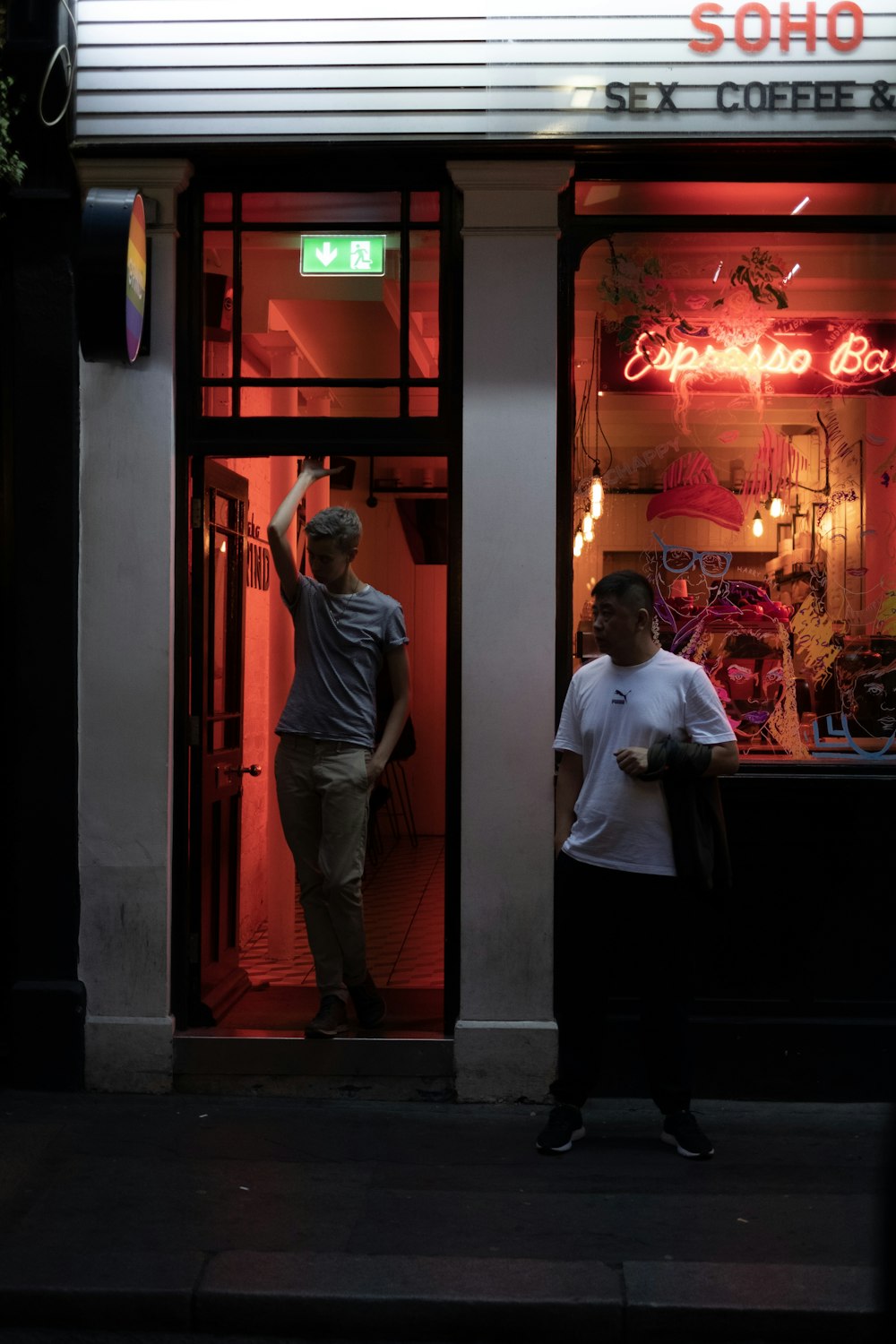 man standing beside door