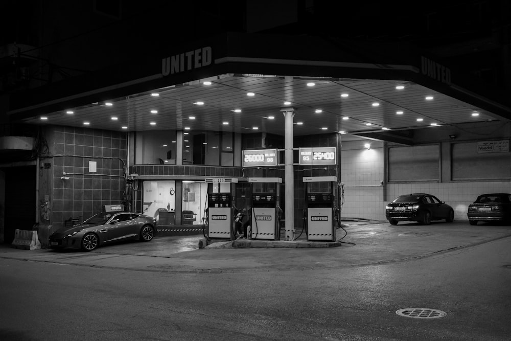 grayscale photo of gasoline station