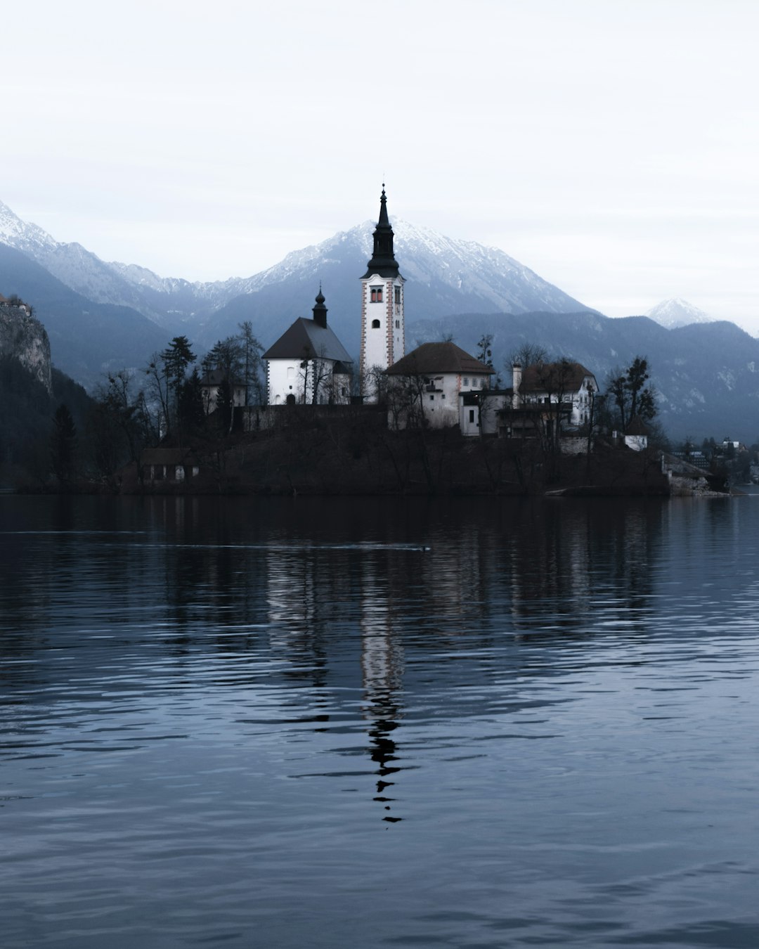 white house near calm body of water