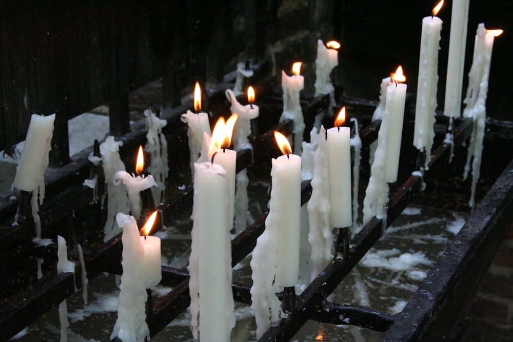 lighted white pillar candles
