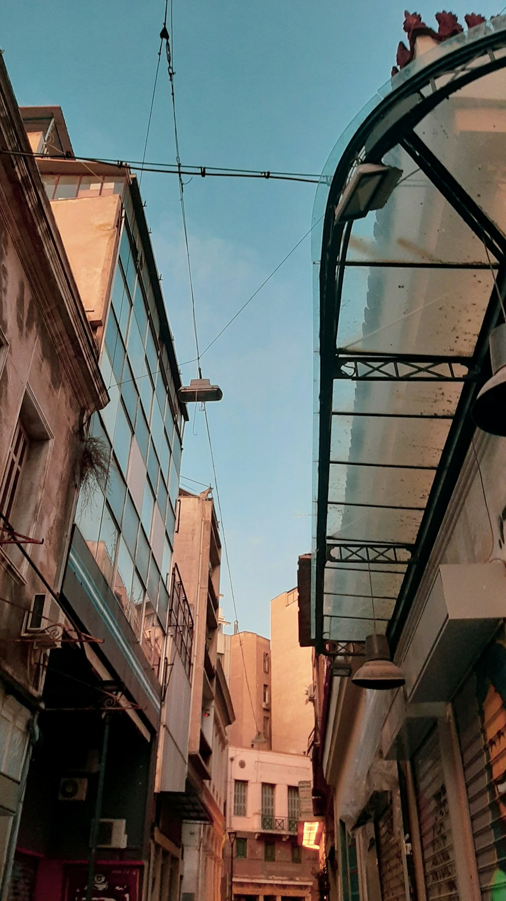 low-angle photography of buildings under blue and white sky during daytime