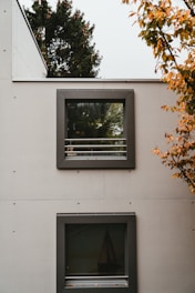 two white wooden framed glass panel doors