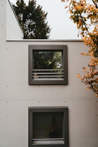 two white wooden framed glass panel doors