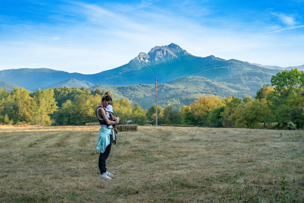 woman carrying girl