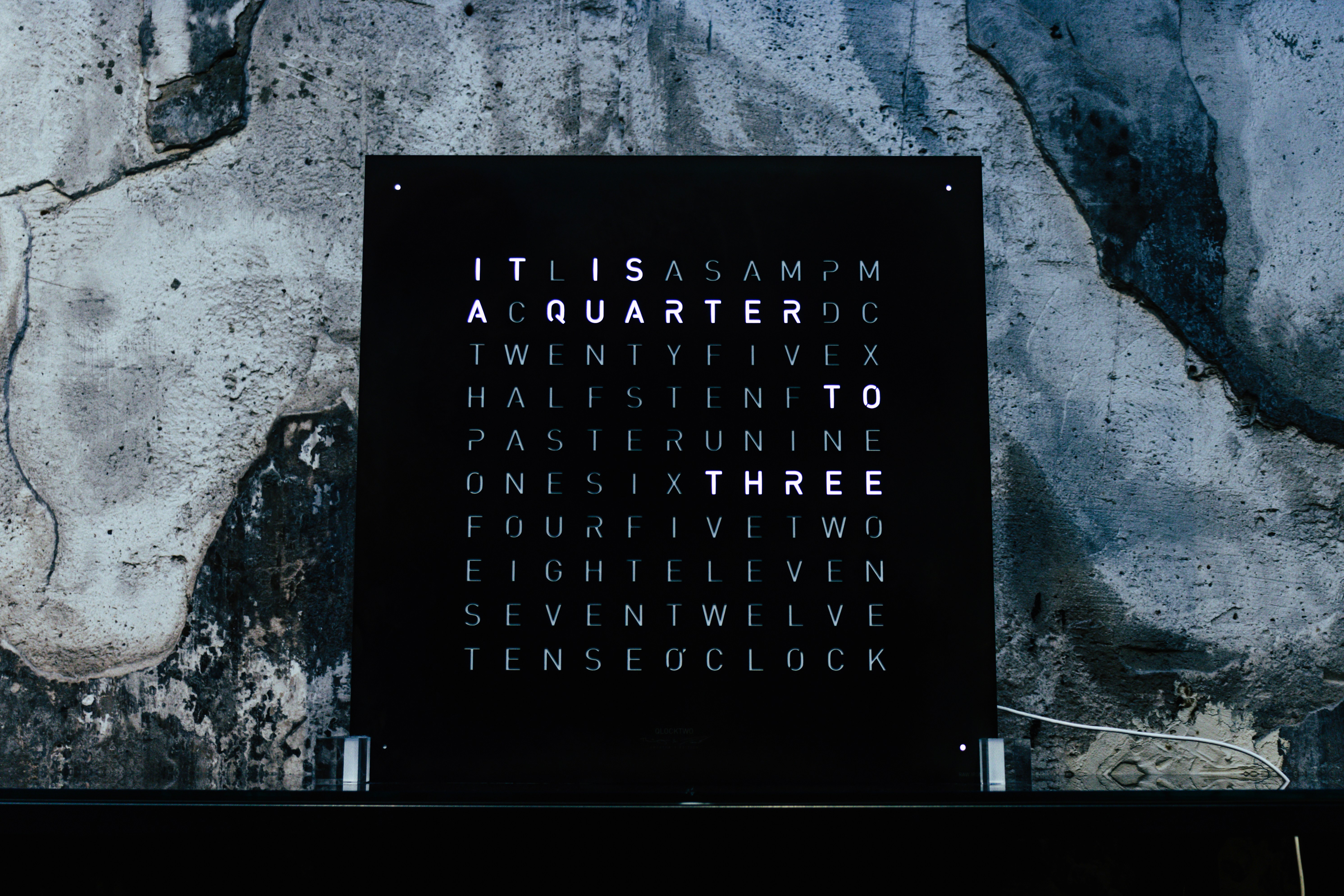 black puzzle board on wall (Photo by Rémi Bertogliati on Unsplash)