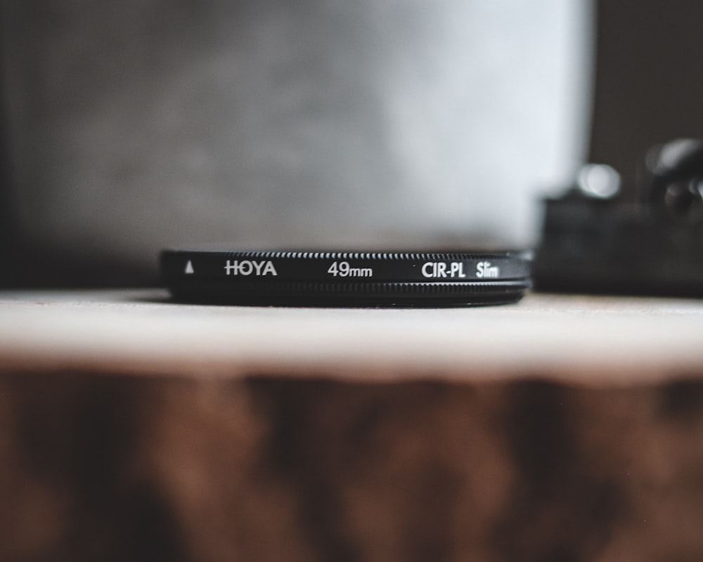 selective focus photography of black Hoya 49 mm zoom lens