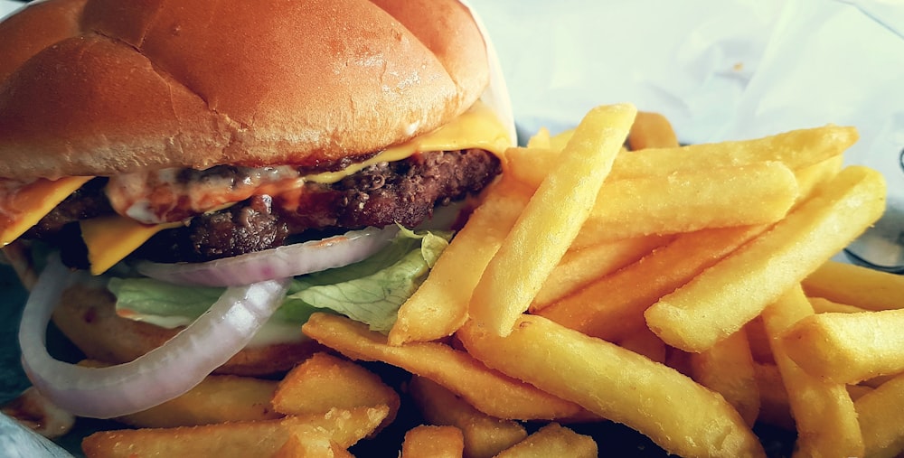 hamburger with lettuce and cheese and fries