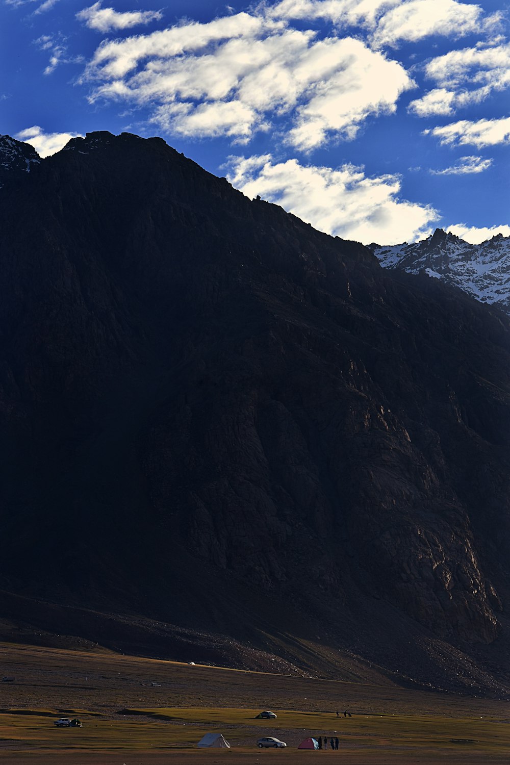 mountain under cloudy sky during daytime