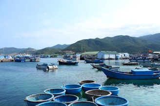 boat near port and mountain during daytime