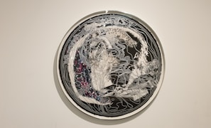 A close-up of intricate laser-cut designs featuring celestial bodies and constellations.