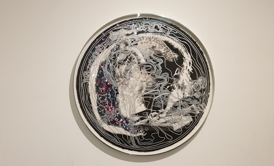 A mystical black obsidian and golden alchemy symbol with sacred geometry patterns over a deep cosmic background.