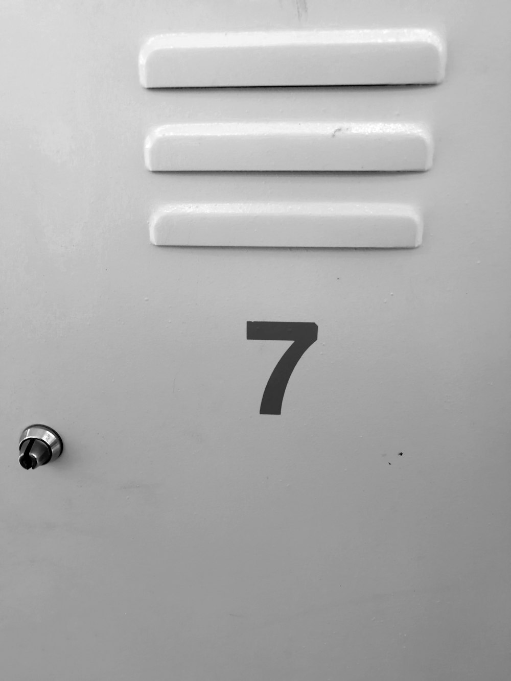 a white door with the number seven on it