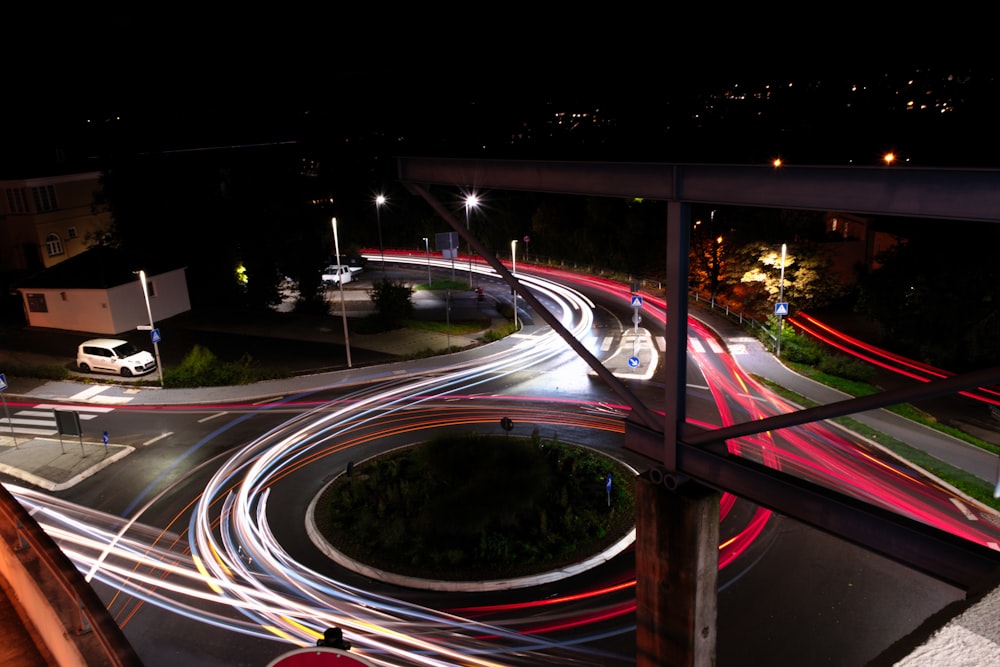 time-lapse photography of vehicle on bridge during nighttime