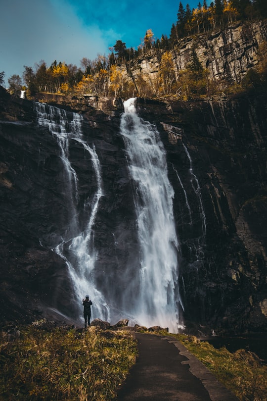 waterfalls under blue sky in Hordaland Norway