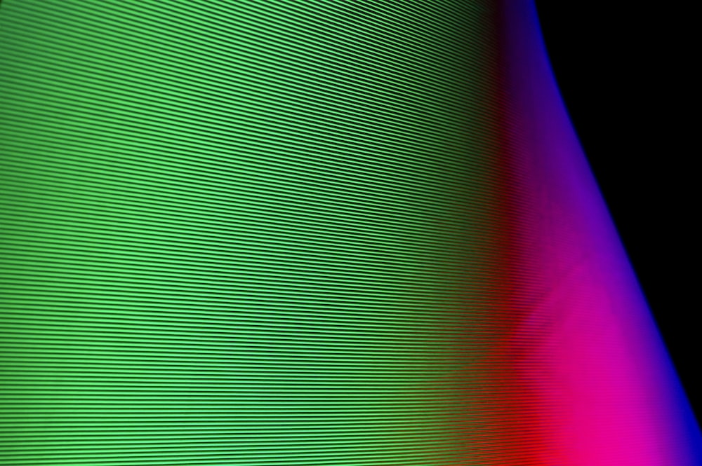 a close up of a colorful object with a black background