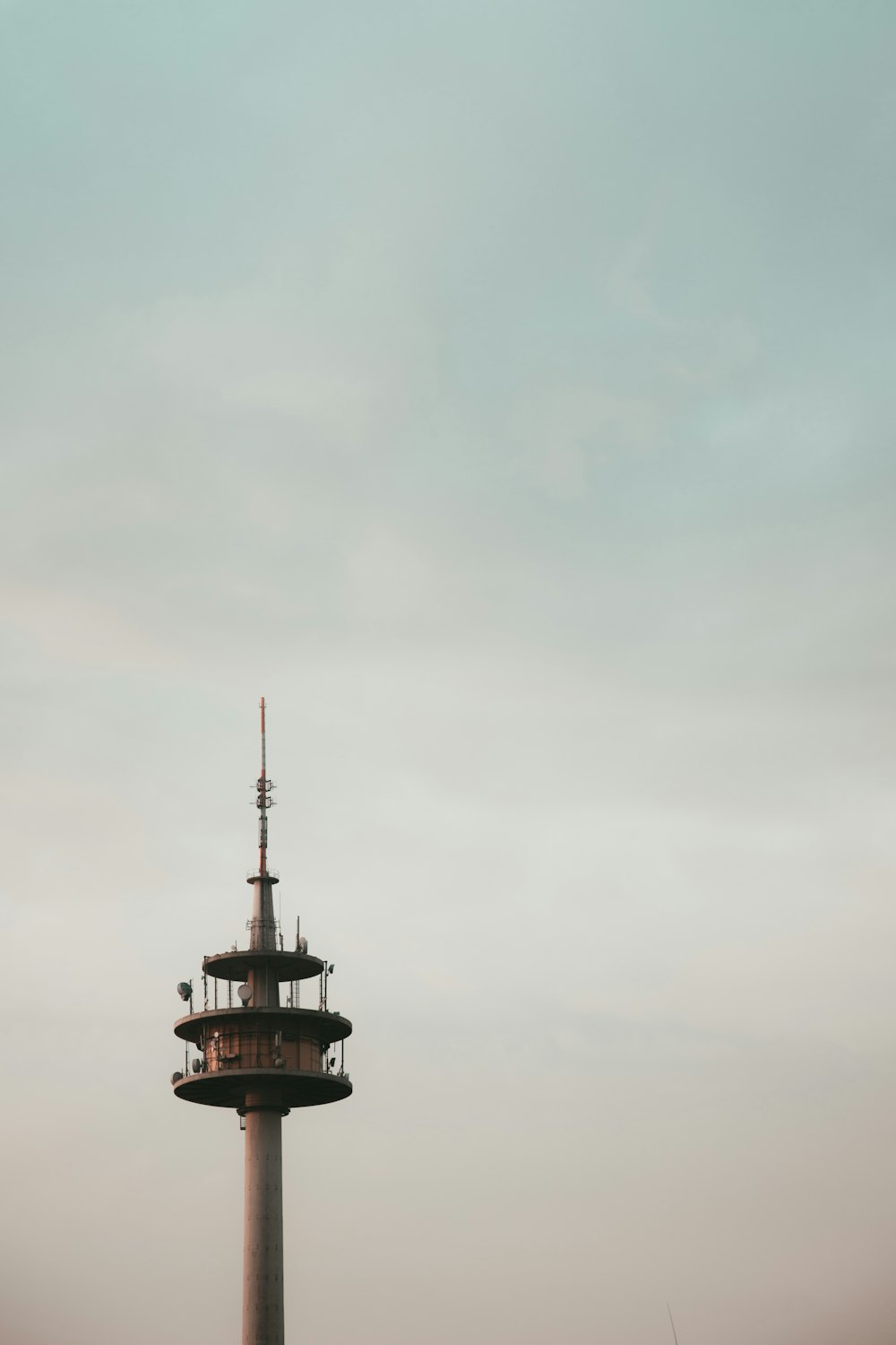 white and brown lighthouse photograph