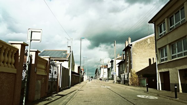A street in the centre under sun and cloud — Nancy, France