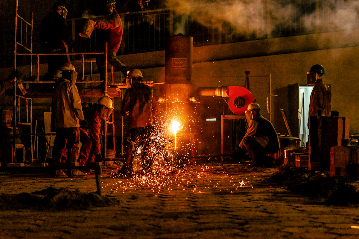 Workers at an electric arc furnace